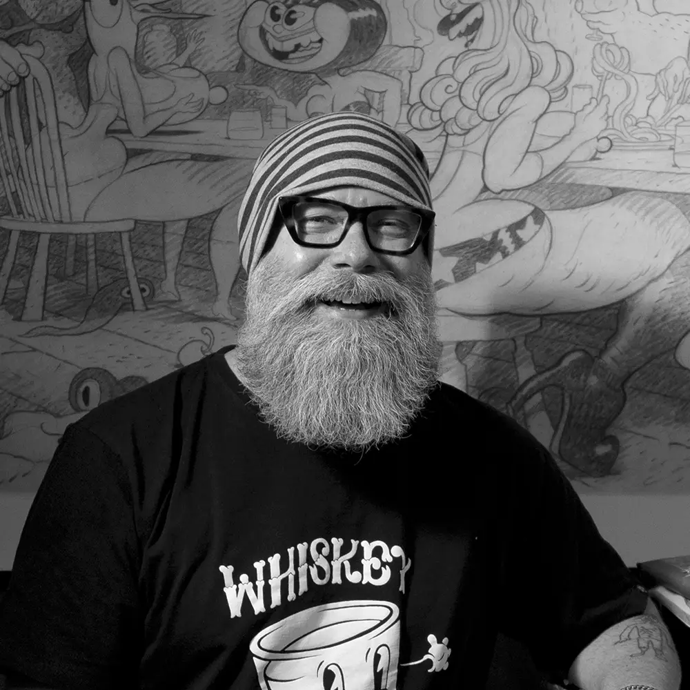 Dave Cooper con mural ao fondo