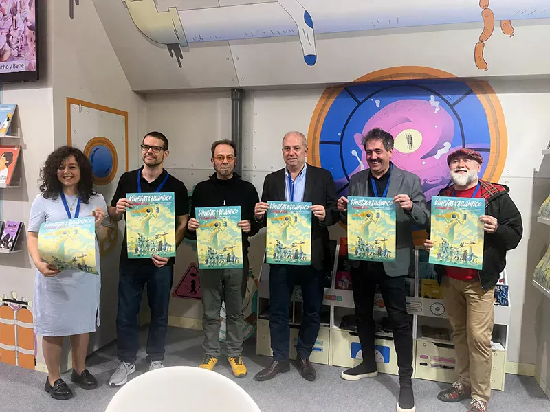 Presentación do cartel Viñetas desde o Atlántico 2026. Persoal responsable do festival amosando o novo cartel na feira de cómic de Barcelona.